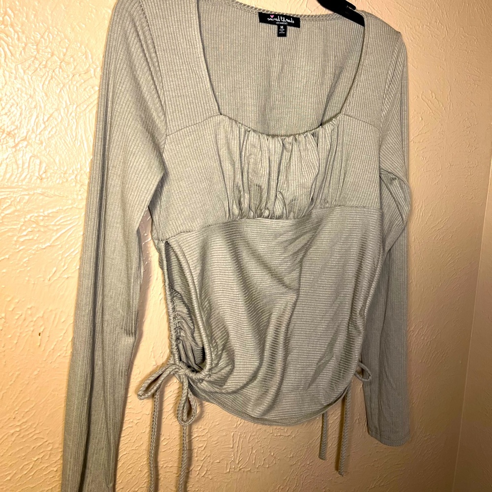 Greyish//greenish body on shirt